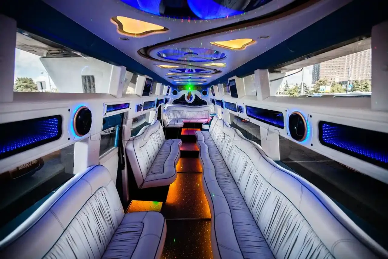 How Limos Are Made the inside of a party bus with white leather seats