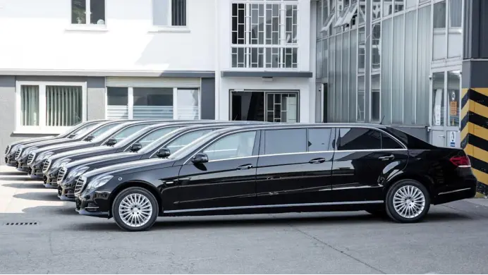 types of limos a row of cars parked in front of a building