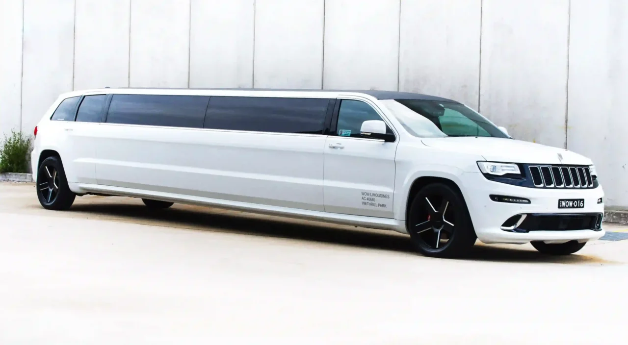 a white limo parked in front of a building